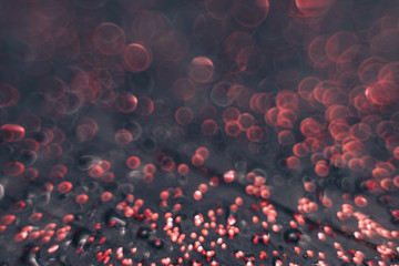 Aufkleber - Beautiful red bokeh on a dark abstract background.