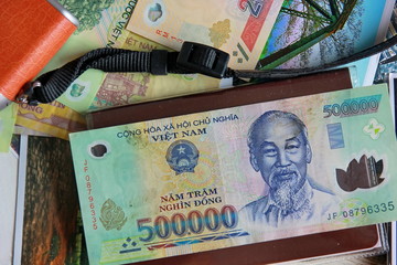 Dong Vietnam money bang note on passport . bank note for payment,seaving ,pay the debt according to the law.