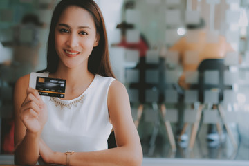 Wall Mural - asian woman with credit card for shopping online.