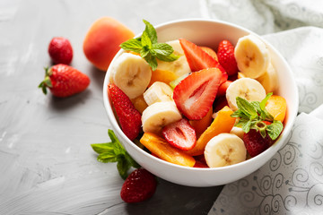 Wall Mural - Bowl of healthy fresh fruit salad