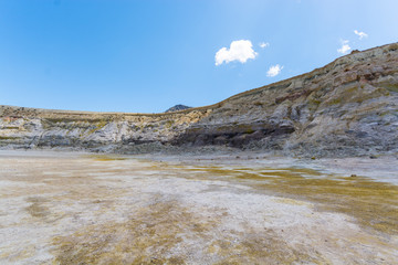 the hydrothermal crater of the sleeping Stefanos volcano is covered with white and yellow sulfur crystals on the island of Nisyros in Greece