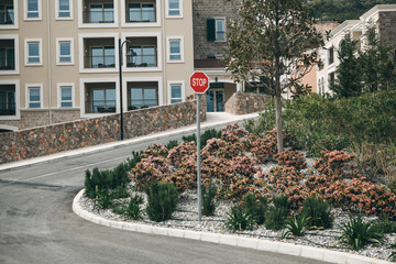 Beautiful view of a modern residential area or district. Residential buildings and the road with traffic stop sign