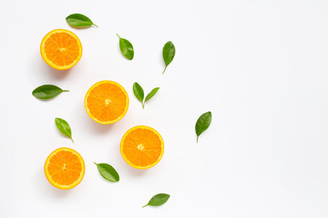 Wall Mural - Fresh orange citrus fruit with leaves isolated on white background.