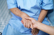 © amazing studio - Holding Touching hands Asian senior or elderly old lady woman patient with love, care, helping, encourage and empathy at nursing hospital ward : healthy strong medical concept