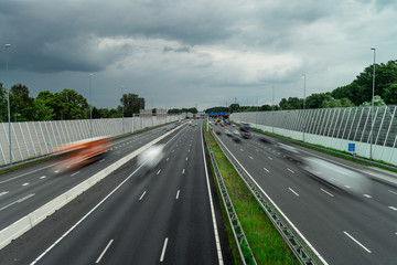 Traffic over the highway, motion blurred traffic, ring east A10, 06/14/2019 Amsterdam the Netherlands, speedway, freeway fast