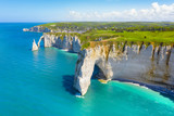 Fototapeta Na ścianę - Picturesque panoramic landscape on the cliffs of Etretat. Natural amazing cliffs. Etretat, Normandy, France, La Manche or English Channel. Coast of the Pays de Caux area in sunny summer day. France