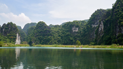 Wall Mural - Boat  tour, landscape, karst mountains and river, Trang An, Ninh Binh, Vietnam. 