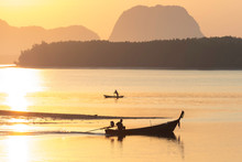 Silhouette Photo Of Fisherman On Boat Go For Fishing In Morning In Krabi Thailand