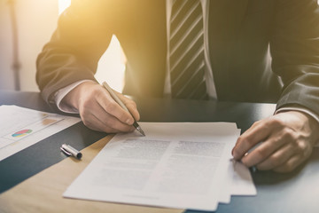 Wall Mural - Business man signing contract, making a deal.