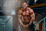Body Builder Workout at the Gym. Performing Cross Over Exercise for Chest Muscles