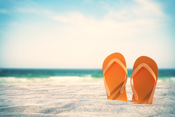 orange flip flops on beach
