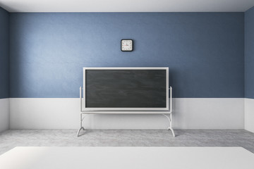Wall Mural - Blue classroom with empty chalkboard
