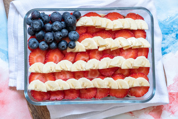 Wall Mural - Patriotic American flag fruit berry dessert with banana, blueberries and strawberries