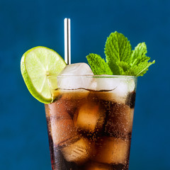 Wall Mural - Coca Coke cocktail in a tall glass cuba libre. refreshing summer drink