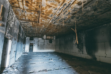 Wall Mural - Dark creepy room in abandoned nuclear power plant in Crimea. First person view, dirty grunge ruined building