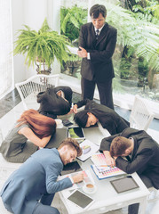 Wall Mural - Worker lazy person sleep exhausted with tired meeting. Diversity group of business people sleeping in conference room after meeting. Executive boss and team unhappy depressed in bored conference.