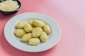 Wall Mural - Preparing gnocchi stuffed with pesto