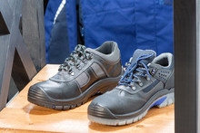 Closeup Of Work Shoes. Black Professional Safety Boots For Male Workers