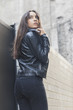 © Freepik - Beautiful young woman adjusting her leather collar jacket