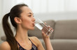 © Prostock-studio - Woman Drinking Clean Water From Glass After Training