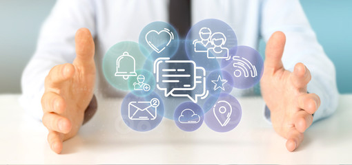 Businessman holding a cloud of social media network icon