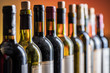 © volff - Line of wine bottles. Close-up.