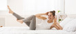 © Prostock-studio - Morning Workout. Woman Doing Abs Exercise On Bed