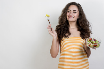 Wall Mural - Woman eating a lettuce salad