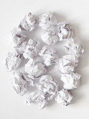 Canvas Print - Waste reduction. Flat lay of crumpled paper ball pile on white surface. Abstract background.