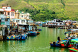 Famous tourist attraction in Hong Kong. Old houses standing in the water in fishing village Tai O, Lantau, Hong Kong, SAR of China.
