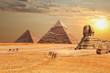 The Sphinx and the Pyramids at sunset in Giza