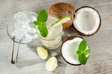 Wall Mural - Coconut water drink on wooden background
