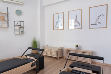 Pilates studio room with reformer beds