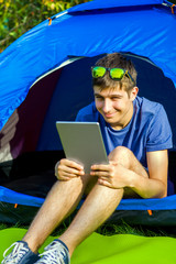 Wall Mural - Young Man with a Tablet