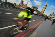 Fast Moving London Bicycle Commuter Crossing Westminster Bridge.