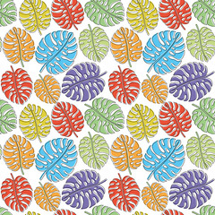 Wall Mural - Seamless pattern with colored tropical leaves on a white background.