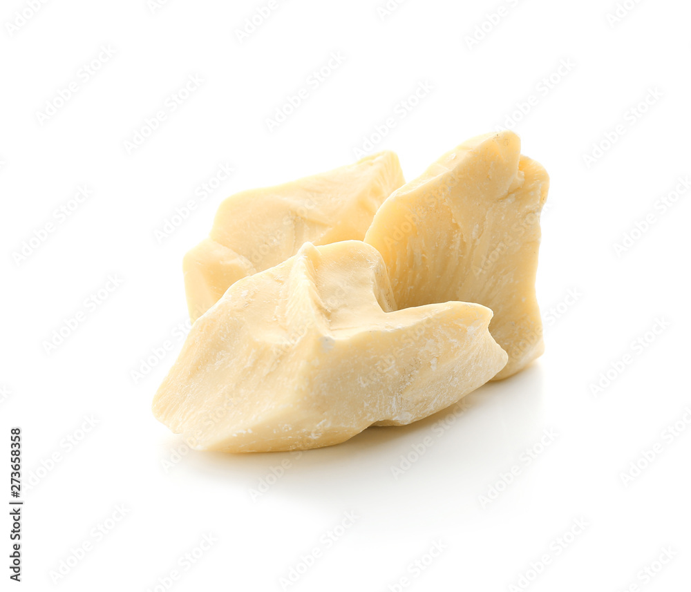 Pieces of cocoa butter on white background