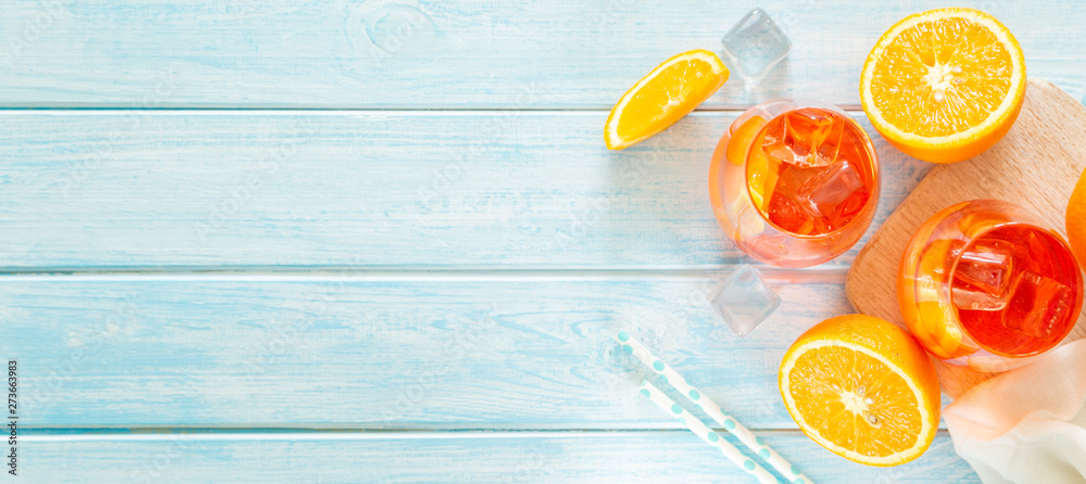 Aperol and ingredients drinks on wood background, copy space - obrazy, fototapety, plakaty 