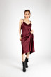 © fan - Asian Chinese Fashion influencer modeling in a wine color silk dress isolated in white background