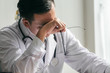 © Anatta_Tan - The doctor is stressed and tired from hard work to take care of patients, to health concept.