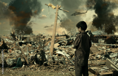 Fotomural Homeless child crying for his family / Military soldiers killed her family and t