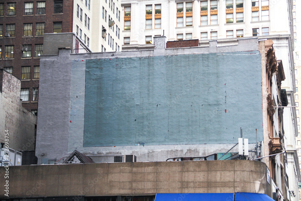 Side of a building in New York with painted-over advert space - obrazy, fototapety, plakaty 