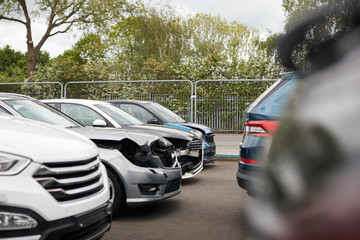 Wall Mural - Cars Damaged In Motor Vehicle Accidents Parked In Garage Repair Shop