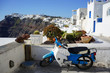 Traditional cubical houses and motorbike of Santorini Island, Greece.
