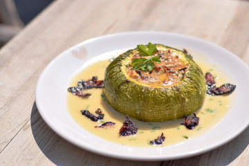 Wall Mural - Baked stuffed Courgette served on the white wine sauce