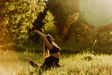 Beautiful Plus Size Girl Doing Yoga In Nature On A Sunny Summer Day. Body Positive, Sports For Women, Harmony, Asana, Healthy Lifestyle, Inspiring Look, Self-love And Wellness.