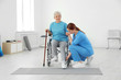 © New Africa - Professional physiotherapist working with elderly patient in rehabilitation center