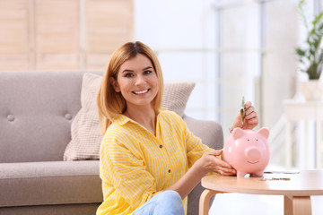 Poster - Woman with piggy bank and money at home