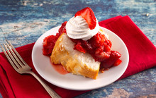 Slice Of Strawberry Short Cake Made With Angel Food Cake And Strawberry Sauce