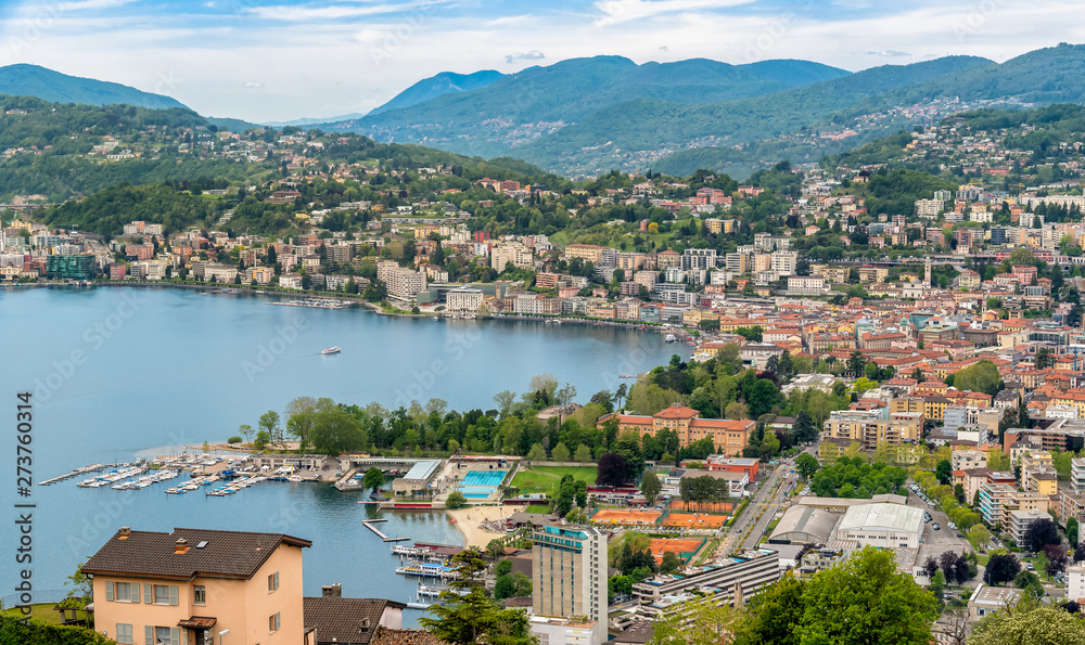 Panoramic view of Lugano city on the shore of Lake Lugano, Switzerland - obrazy, fototapety, plakaty 
